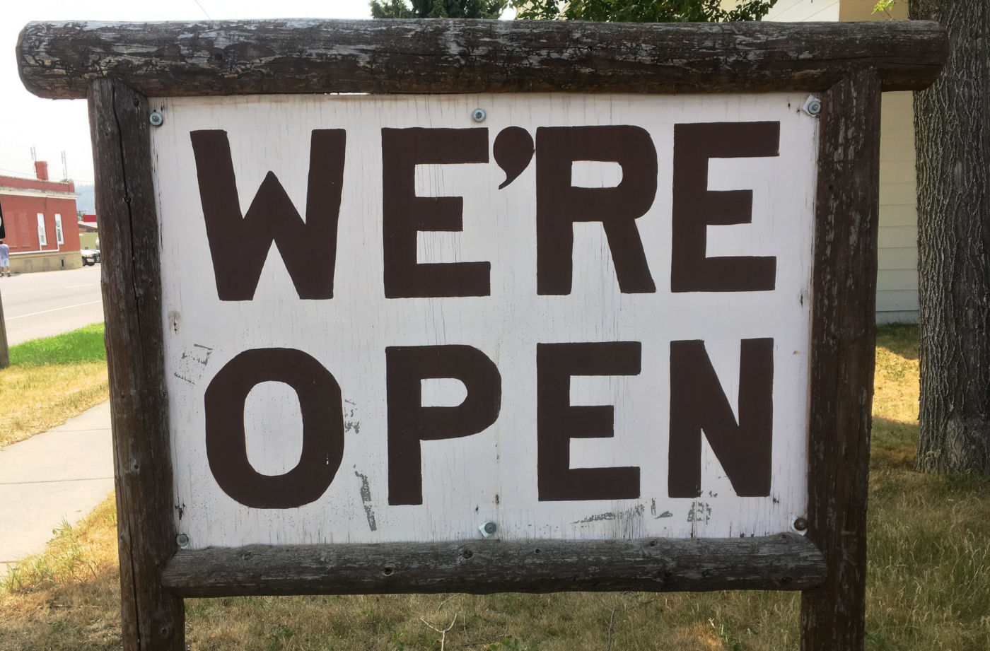 A sign saying We're open.